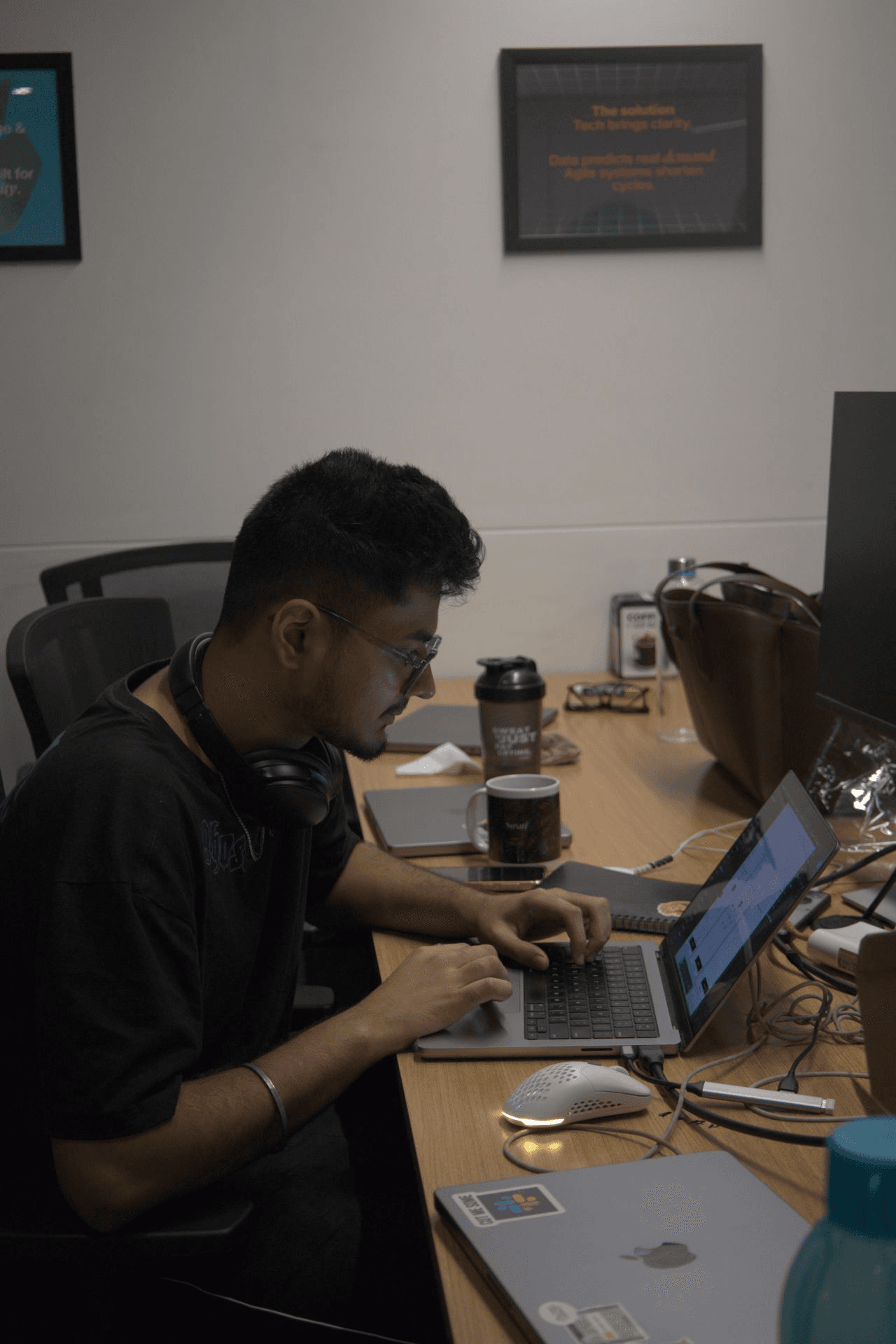 Sameer heads-down building a project at the Virgio hackathon