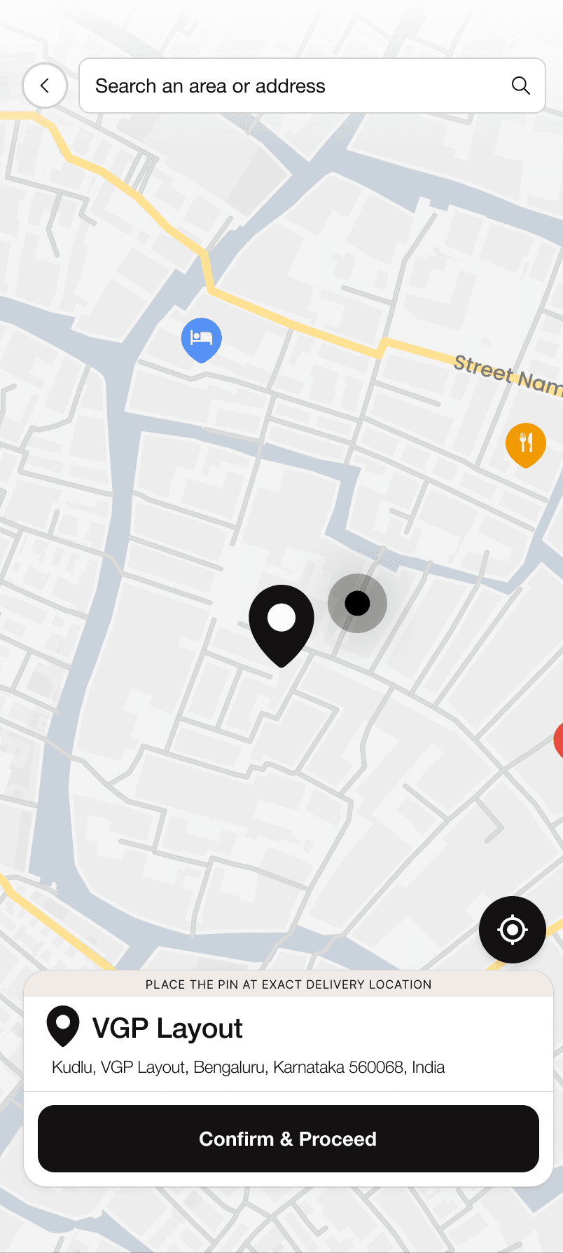 Pick-your-location screen — a full-screen map with a draggable delivery pin, an address search bar, and a Confirm & Proceed action